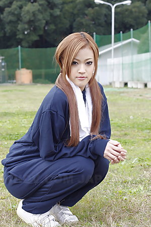 Long haired An Umemiya poses outdoor on field