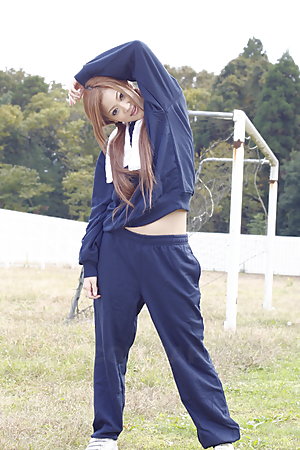 Long haired An Umemiya poses outdoor on field