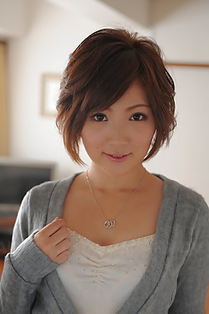 Kaede Oshiro with busy mouth shows sexy legs