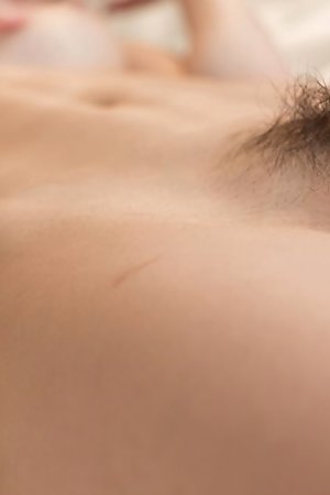 Hairy pussy hottie Shino Aoi gets eagerly finger-blasted while chilling on a bed