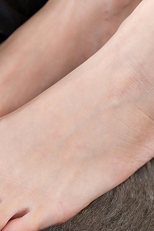 Rena Matsumoto carefully jerking that thick dick with her perfect-looking feet