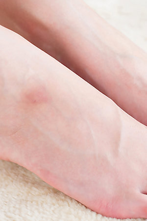Pantyhose-clad beauty Rio Kamimoto takes them off to give a guy a great footjob